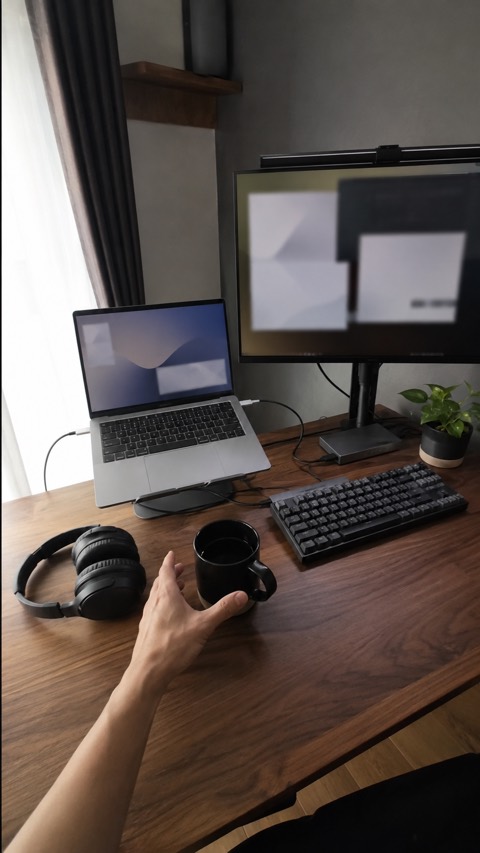 Reaching for coffee at the desk