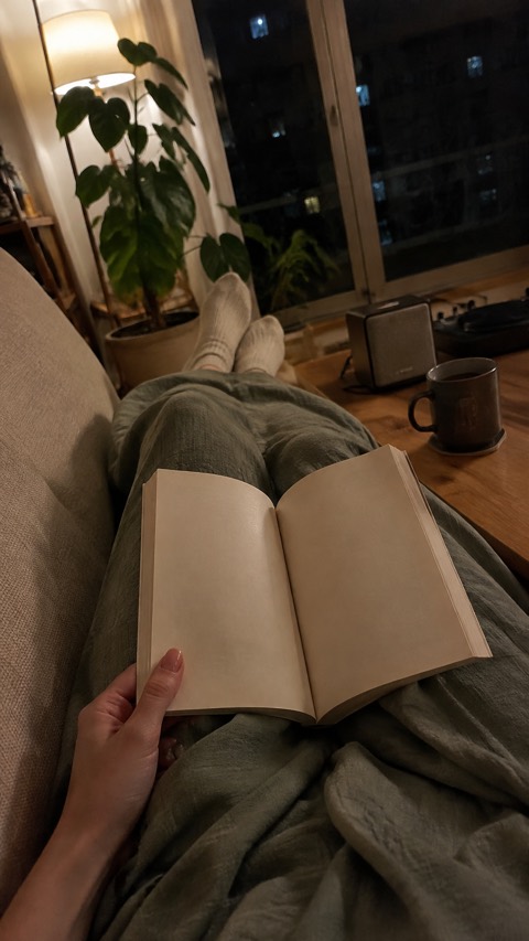 Night, reading on the sofa